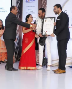 Dr. Amit Borade receiving the Most Trusted Educational Consultancy - 2019 award from Jackie Shroff