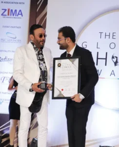 Dr. Amit Borade receiving the Most Trusted Educational Consultancy - 2019 award from Jackie Shroff